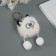 Fluffy on the ring "oblique eyes" white 9.5x6x6 cm