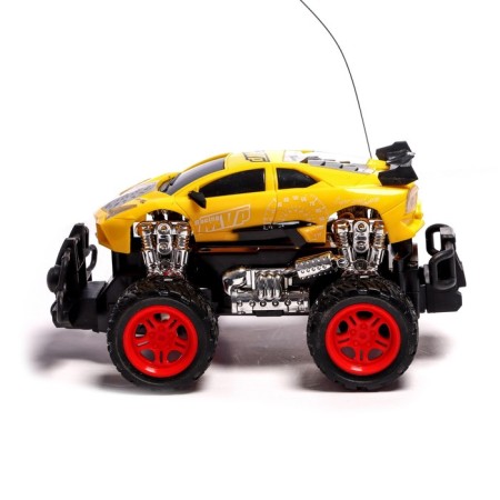 The radio -controlled jeep "Supergracker" works on the battery, the color is yellow-1