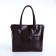 Luggage bag with a zipper, 3 external pockets, a long belt, a dark brown color