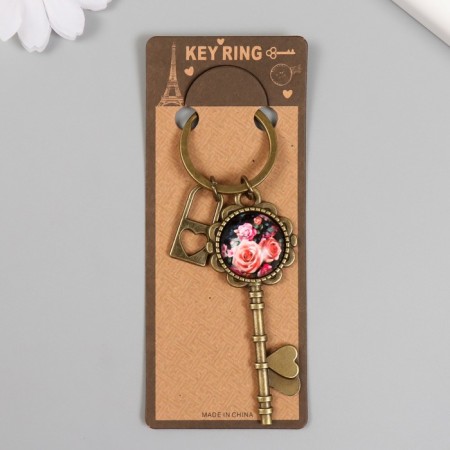 A keychain metal, glass "Castle with a heart and a key with roses" bronze 10 cm