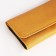 Women's wallet on the button, yellow color