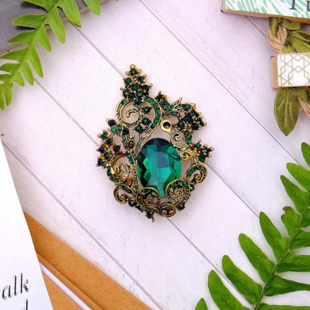 Brooch "openwork", emerald color in black gold-1