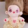Doll "idol", blond hair, in a yellow dress
