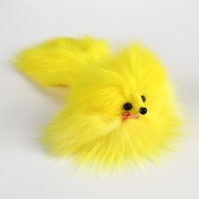 A mouse made of natural fur, up to 11 cm with a tail, yellow