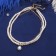 Beads 3 tier "Rochel" drop, ball No. 10, white color in gold, l = 42 cm