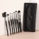 A set of makeup brushes, 7 items, a cover on a button, black color
