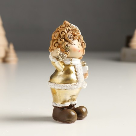 Polystone souvenir "Baby in a gold caftan and cap, with a bird/gift" Mix 4x5x10 cm 94988-2