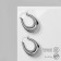 Earrings Metal are “wide” volumetric, silver color