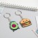 A set of key fob “I swing a nut I burst dumplings”, 2 pcs.