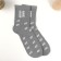 A gift for socks in a bank with a print "which is not afraid of either cold or wind" (male)
