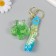 A keychain plastic with a carbine, a strap "Flower with shells" Water with a decor of 1.8x5.3x5.6 cm 104732