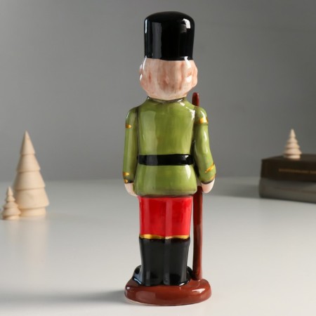 Souvenir Ceramics "A mustachioed Nutcracker in a green-red camisole with a gun" 25x8x6.5 cm-2