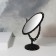 The mirror is desktop, bilateral, with an increase, a mirror surface is 11 × 15 cm, the color is black