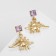 Earrings with rhinestones "dinosaurs", purple color in gold