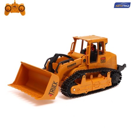 Radio -controlled bulldozer "Stroykhnika", a movable bucket, works from the battery