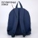 Backpack school textile art, with an overflowing patch, the color of the dark blue