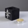 A candle in a wooden candlestick "Cube, hieroglyphs. Good luck", color: "Eben", 6x6x6 cm, mango aroma