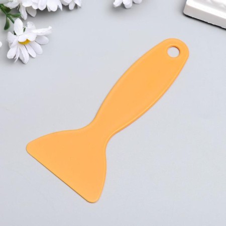 Tool plastic scraper for smoothing on a flat surface 13x6 cm