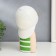 Polystone souvenir "Baby in a white baseball cap, with a gold bubble" Green strip 26x15x18 cm