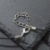 Unisex “Dragon” pendant with a sword, color black silver on a black lace, 44 cm