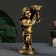 The candlestick "Angel" in the left hand, gold, 14x8x22 cm, for a candle d = 4 cm