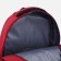A backpack with a zipper, 4 outer pockets, red color