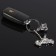 Cartage keychain, "bike with a helmet", chrome