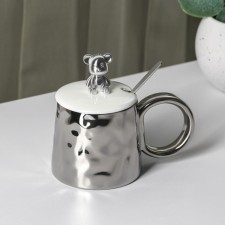 Ceramic mug with a spoon 