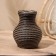 Black vase 15x15x20 cm (+/- 3 cm)