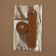 The fastener is sewn for a bag, on a button, made of genuine leather, 13.5 × 2.5 cm, brown/silver color