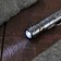 A glass-glass with a flashlight and a knife. Mix