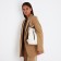 Women's backpack made of artificial leather with lightning, 4 pockets, milk color