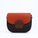 Richet bag on a magnet, a long belt, an orange/brown color