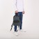 A backpack with a zipper, "saxi", outer pocket, dark gray color