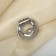 Clip for the scarf "pearl curl", the color is white in matte silver