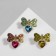 Brooch "Heart" with a bow, color mix in gold (indivisible packing 12 pcs., Price per pcs.)