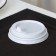 A plastic disposable lid for a white glass, with a valve, d = 8 cm