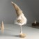 Interior doll "Santa Claus in a beige fur coat with a star on a cap" 19x12x45 cm