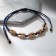 Bracelet "shell" on the thread, the color is silver-blue in gold, d = 6 cm