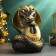 The piggy bank "Snake with the horseshoe" Black-gold, 21cm