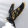 Polystone souvenir "A man in a white hat with a black bird behind him" 48x23x19 cm