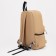 A backpack with a zipper, an outer pocket, 2 side pockets, beige color
