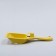 A scoop for a cat toilet 22.5 x 9.5 x 4 cm, light yellow