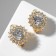 Clips "Sunflower", white color in gold