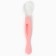 A spoon of children's silicone for feeding, pink color