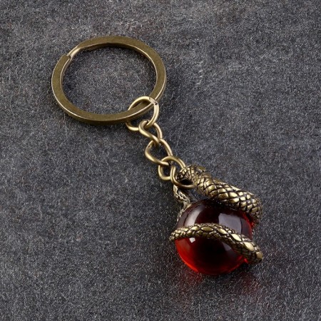 Souvenir-codes "Snake with a ball", brass, amber, 2x2x8 cm