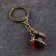 Souvenir-codes "Snake with a ball", brass, amber, 2x2x8 cm