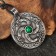 Amulet "coil" with a stone malachite, 35x43 mm, metal