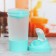 Sports shaker with a bowl for protein, turquoise-white, 500 ml