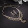 Set 2 objects: earrings, necklace "Phoenix" circle, white-black color in gold, 35 cm